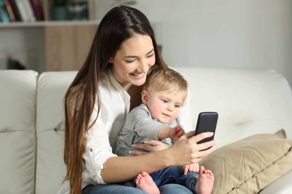 mum using co-parenting app on phone